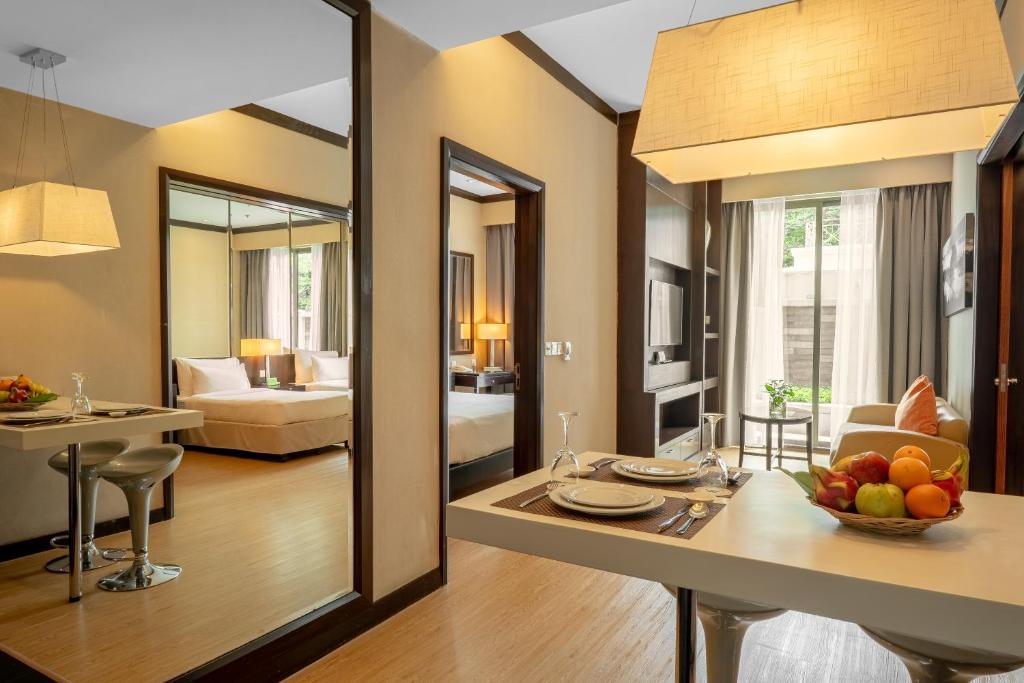 Postel nebo postele na pokoji v ubytování Micasa All Suites Hotel