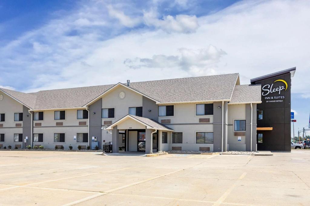 an empty parking lot in front of a hotel at Sleep Inn &amp; Suites Salina I-135 in Salina