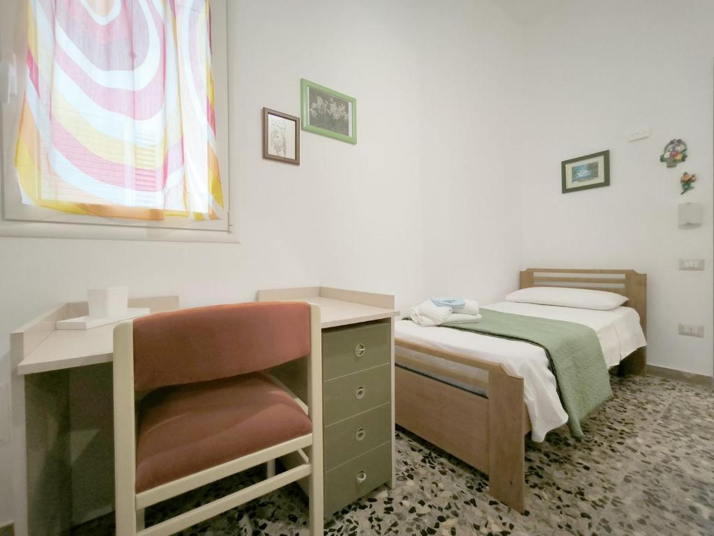 Łóżko lub łóżka w pokoju w obiekcie Domus Petrosa