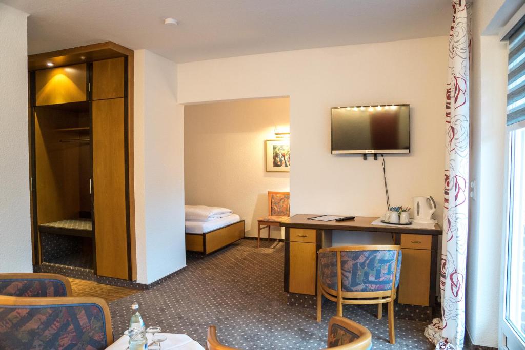 TV a/nebo společenská místnost v ubytování Hotel Chalet