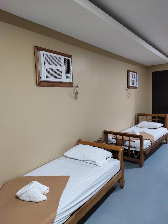 Postel nebo postele na pokoji v ubytování Raya Del Sol Dive Resort