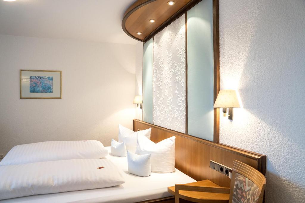 Postel nebo postele na pokoji v ubytování Hotel Chalet