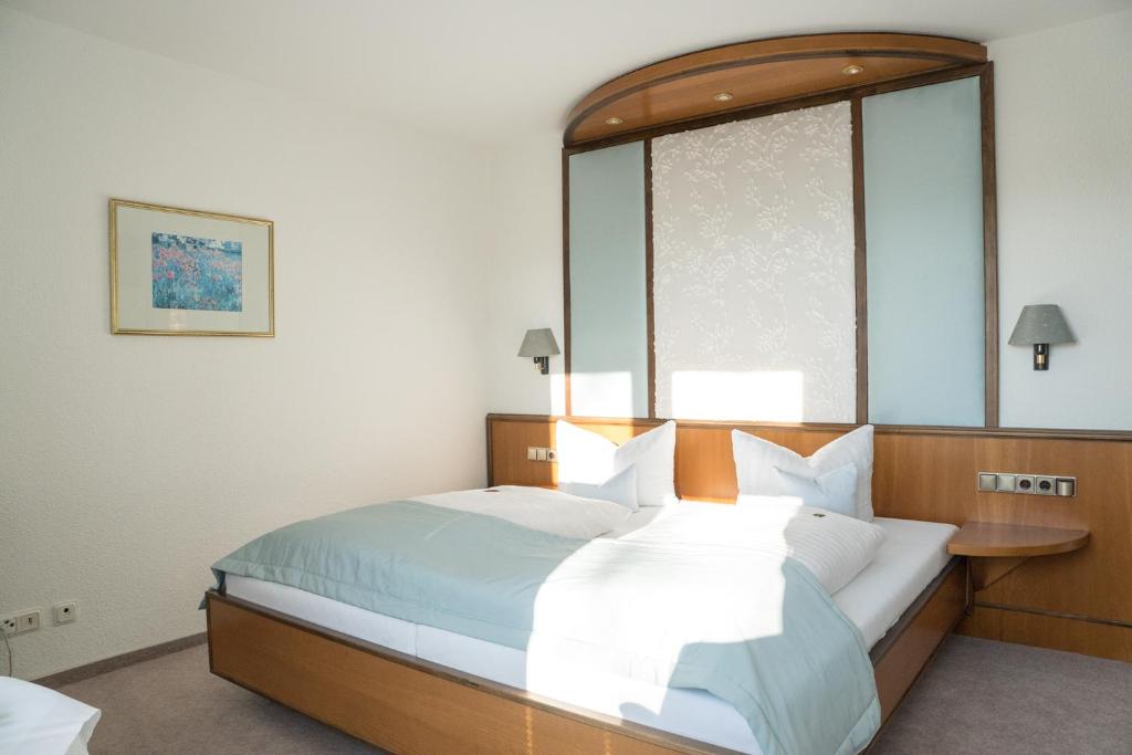 Postel nebo postele na pokoji v ubytování Hotel Chalet