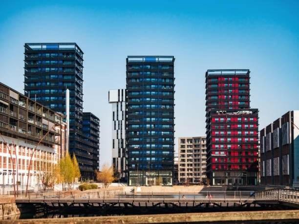 two tall skyscrapers in a city with buildings at Appartement moderne au centre ville in Strasbourg