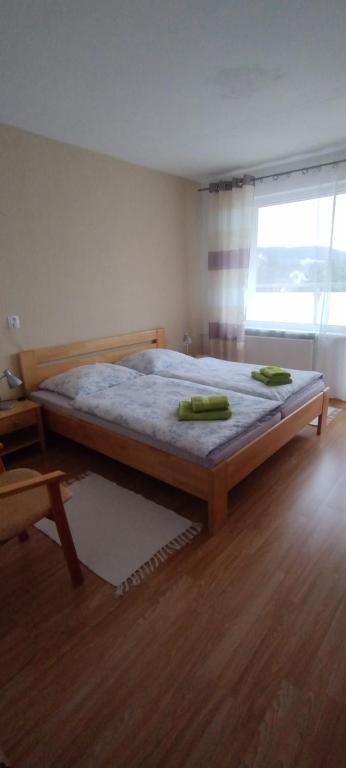 Postel nebo postele na pokoji v ubytování Hýbadlo