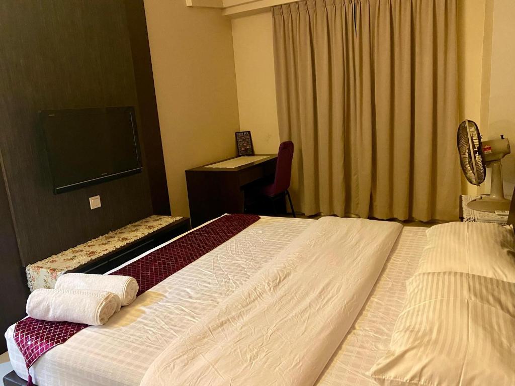 Postel nebo postele na pokoji v ubytování Homestay @ Kinta Riverfront Ipoh