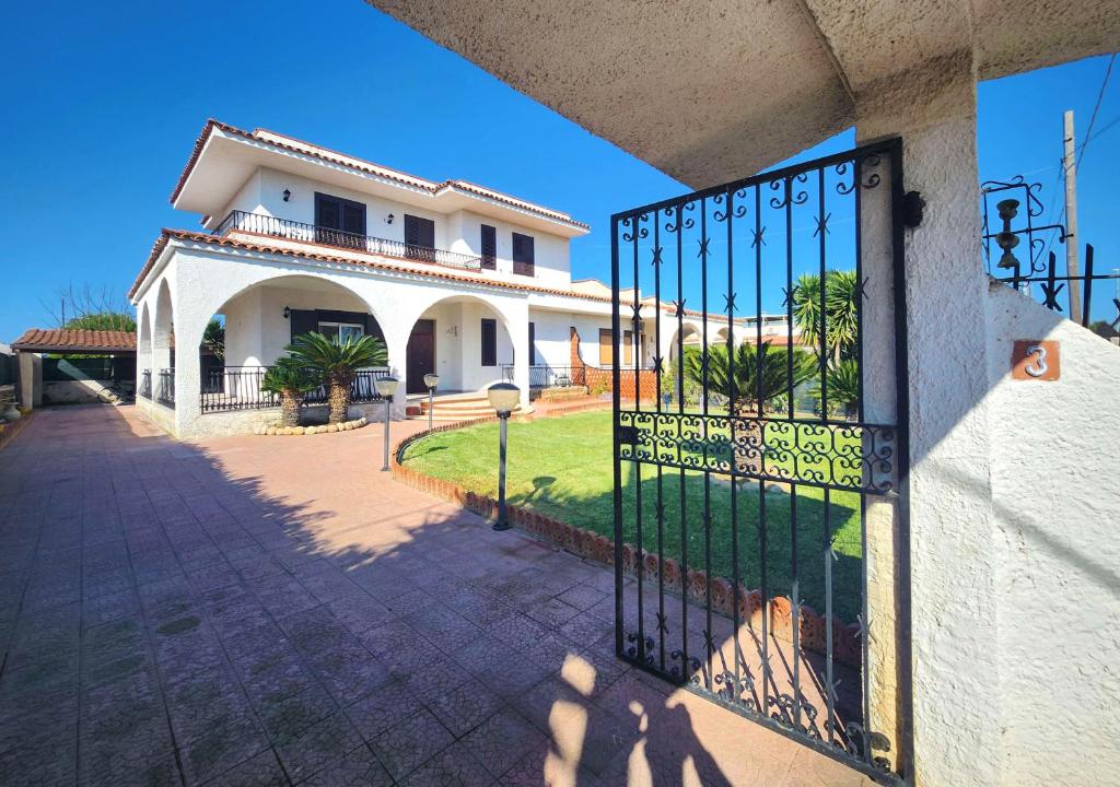 a house with a gate in front of it at Villa Charlene in Terrauzza