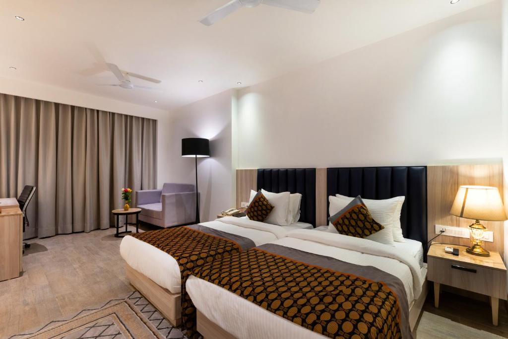 Postel nebo postele na pokoji v ubytování The OPO Delhi Aerocity