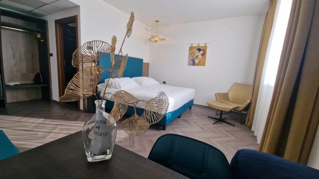 Postel nebo postele na pokoji v ubytování Ancora Sport Resort Hotel