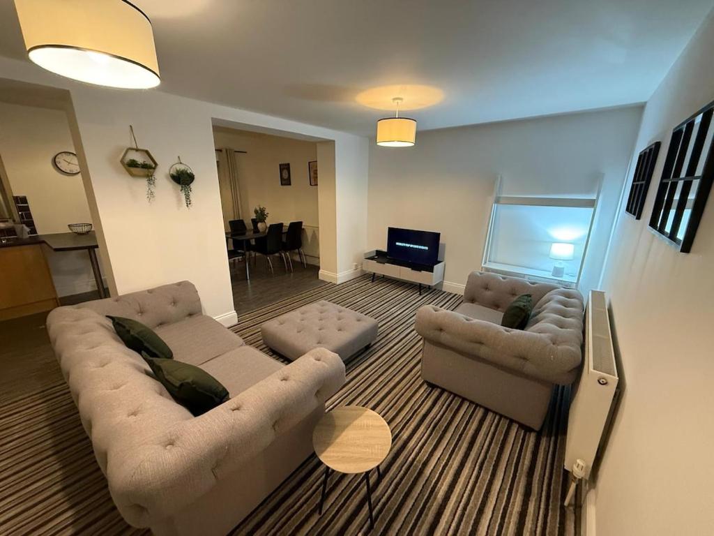 a living room with two couches and a television at ResiLets - Newsham Road -Large 2 BR Short Stay Apartment for Holidays Contractors Visitors in Blythe