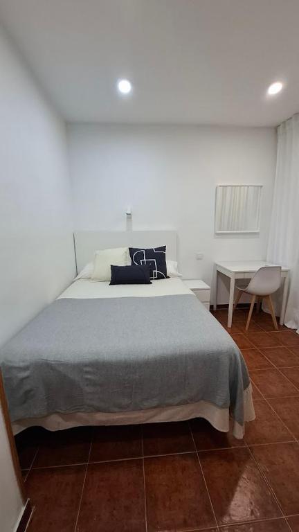 Postel nebo postele na pokoji v ubytování Hostal Bellas