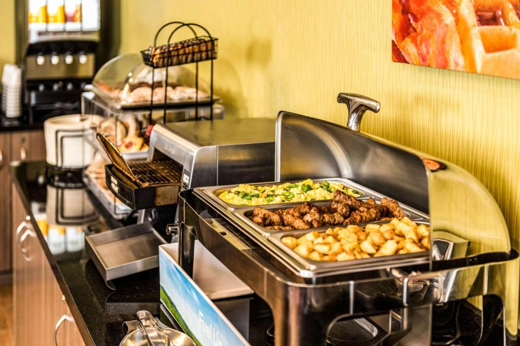 a grill with many different types of food on it at Comfort Inn in Amherst