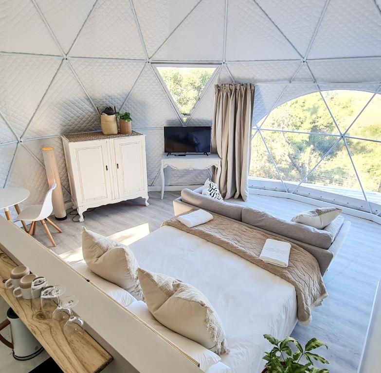 a room with two beds in a tent at Freedom Tiny Homes Resort in East London
