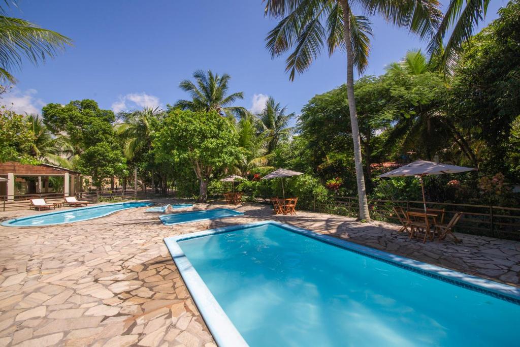 een afbeelding van een zwembad in een resort bij Pousada Ponta de Mangue in Maragogi