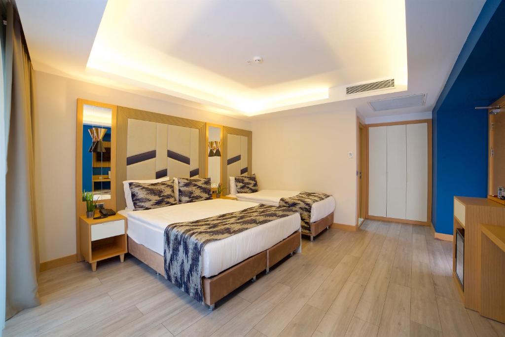 Letto o letti in una camera di Downtown Sirkeci Hotel