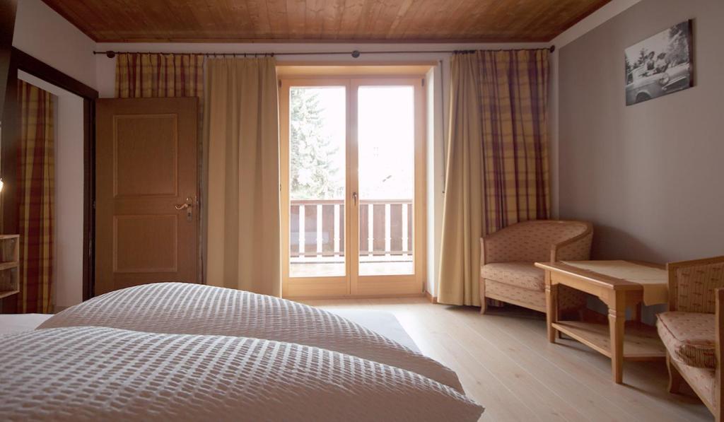 Postel nebo postele na pokoji v ubytování Alpenresidenz Maria