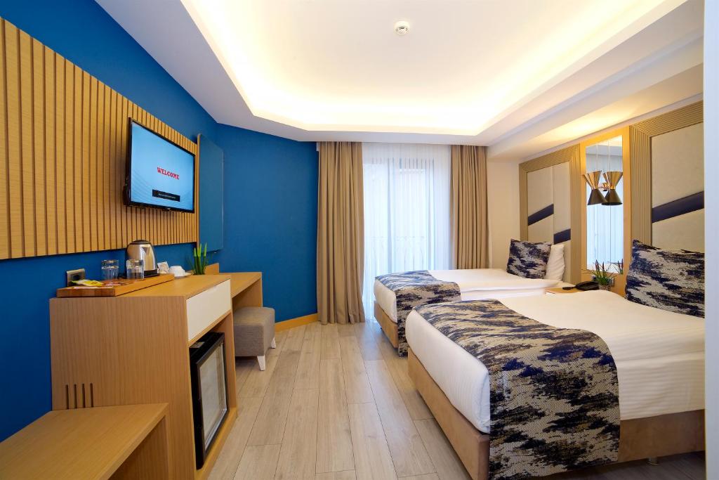 Letto o letti in una camera di Downtown Sirkeci Hotel