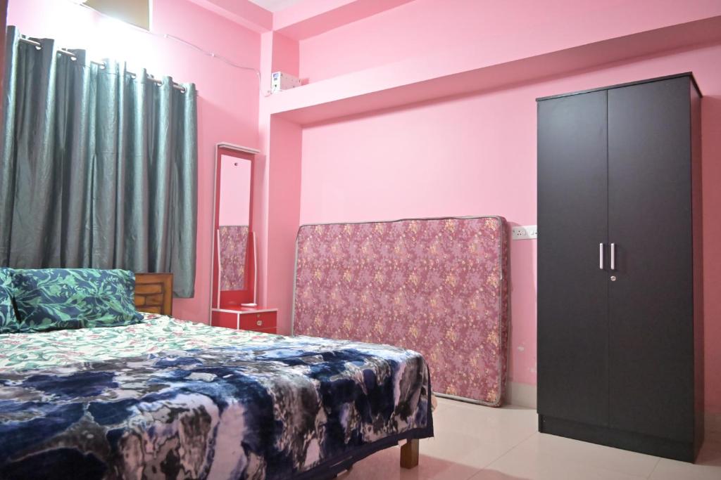 Postel nebo postele na pokoji v ubytování Mishra's Homestay