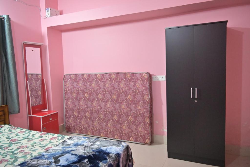 Postel nebo postele na pokoji v ubytování Mishra's Homestay