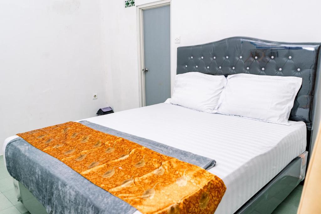 Postel nebo postele na pokoji v ubytování Banyu Sri