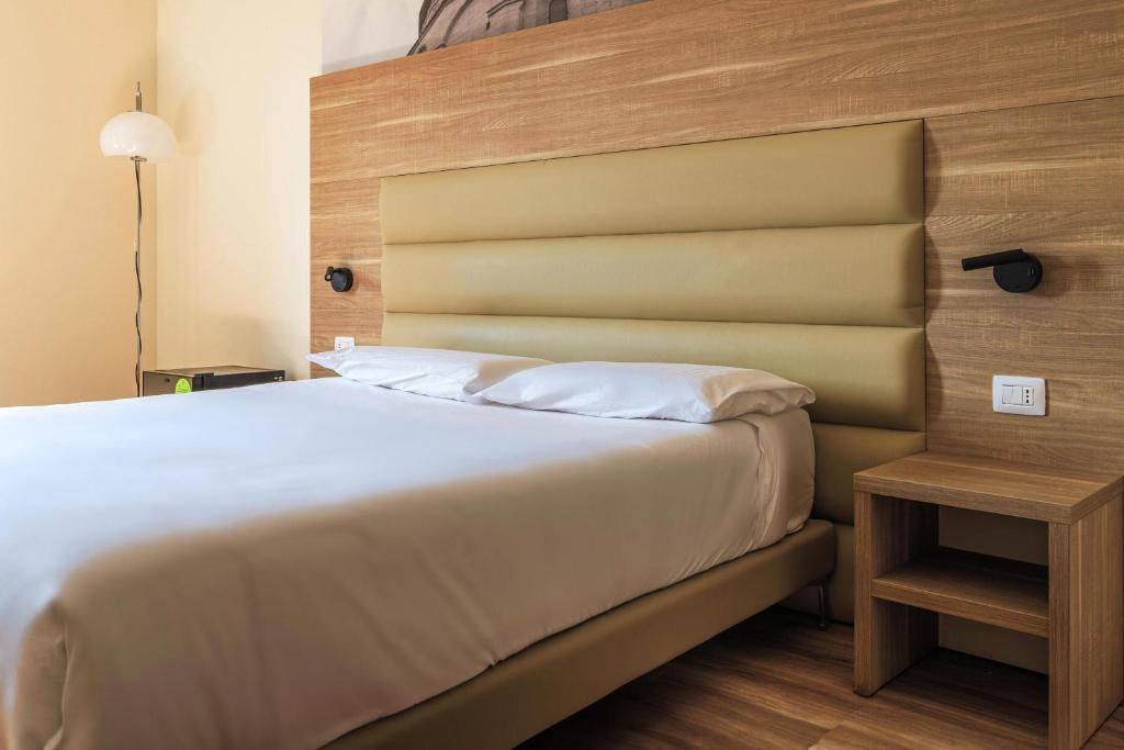 Postel nebo postele na pokoji v ubytování B&B HOTEL Fabriano Janus