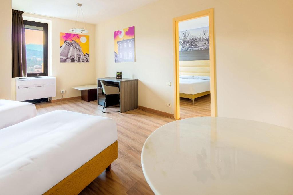 Postel nebo postele na pokoji v ubytování B&B HOTEL Fabriano Janus
