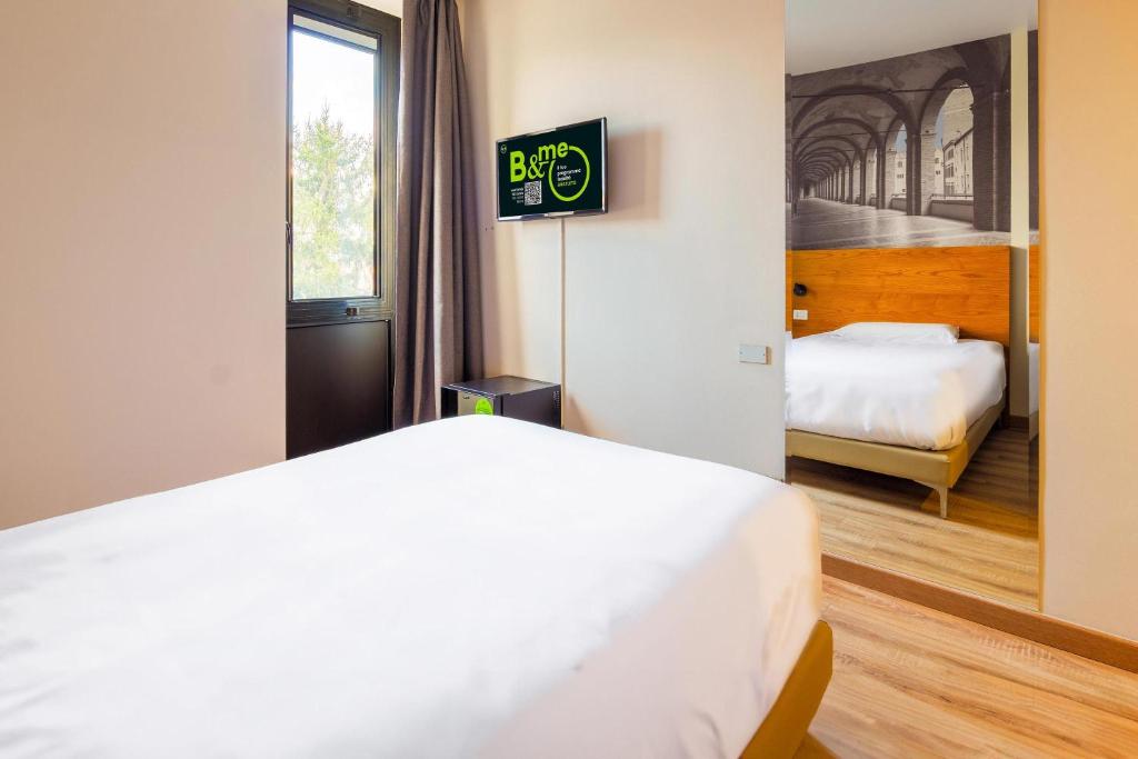 Postel nebo postele na pokoji v ubytování B&B HOTEL Fabriano Janus