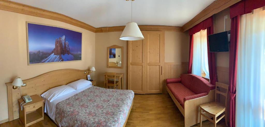 Letto o letti in una camera di Albergo Garnì Ajarnola