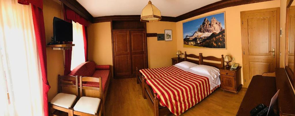 Letto o letti in una camera di Albergo Garnì Ajarnola