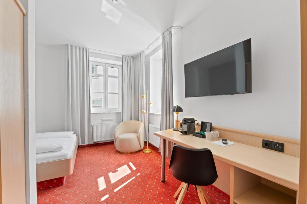 Postel nebo postele na pokoji v ubytování Steiners Hotel Airport-Messe