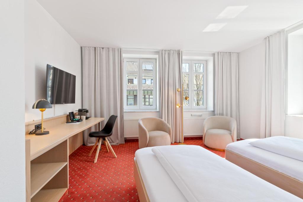 Postel nebo postele na pokoji v ubytování Steiners Hotel Airport-Messe