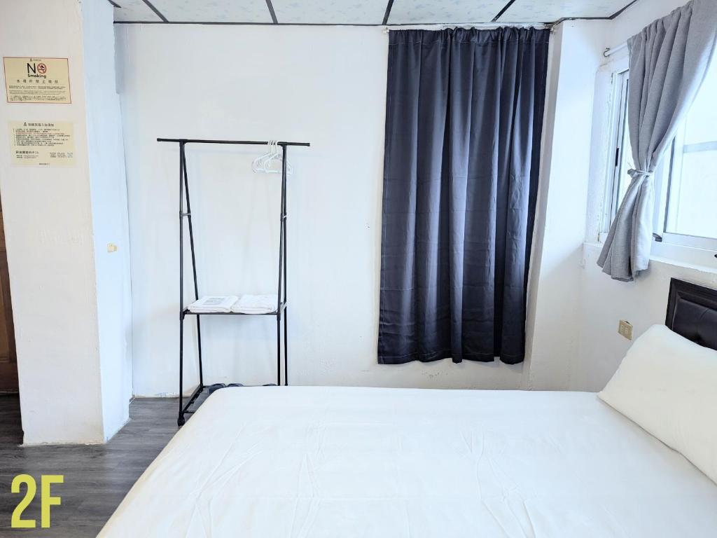 Postel nebo postele na pokoji v ubytování A-Lang Homestay