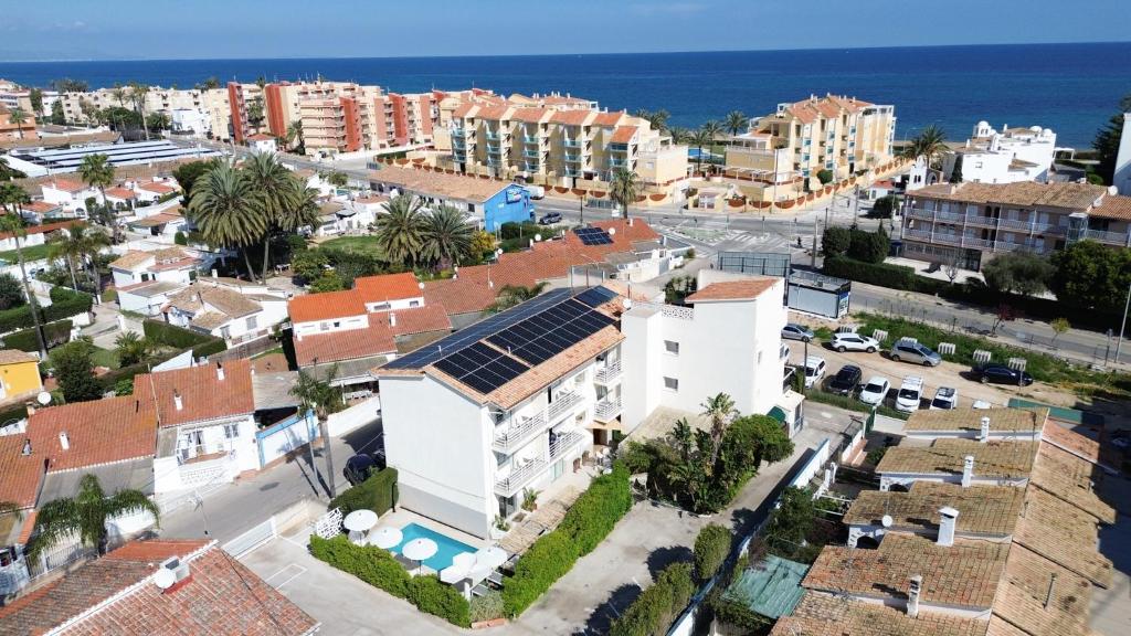 an aerial view of a city with buildings and the ocean at Hotel Rhys Denia - Only Adults in Denia