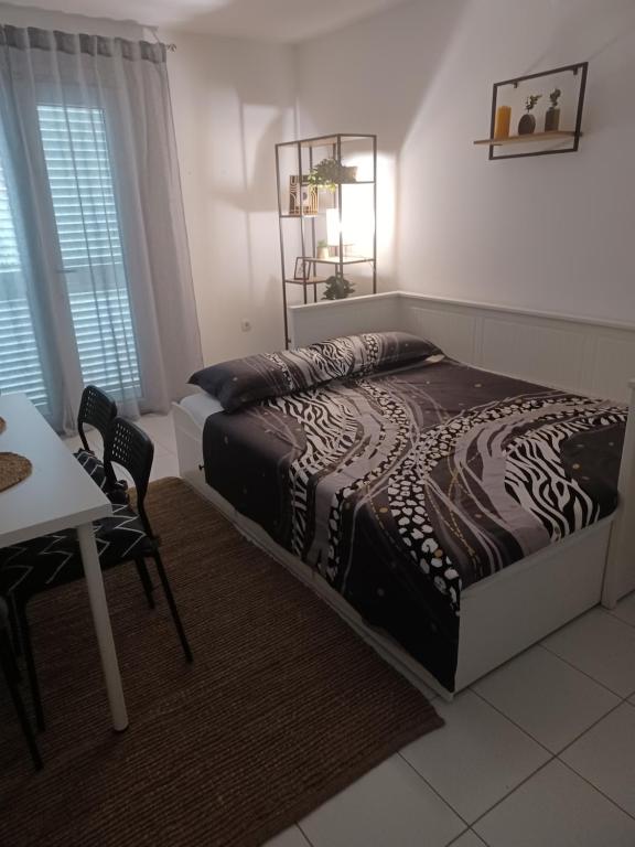 Postel nebo postele na pokoji v ubytování Apartmani Ana - Meka Draga