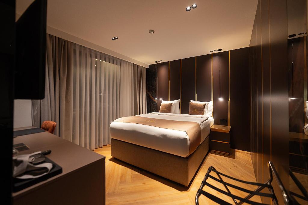 Postel nebo postele na pokoji v ubytování Hotel Opera