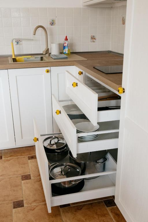 Kuchyň nebo kuchyňský kout v ubytování Csillagvirág Apartman