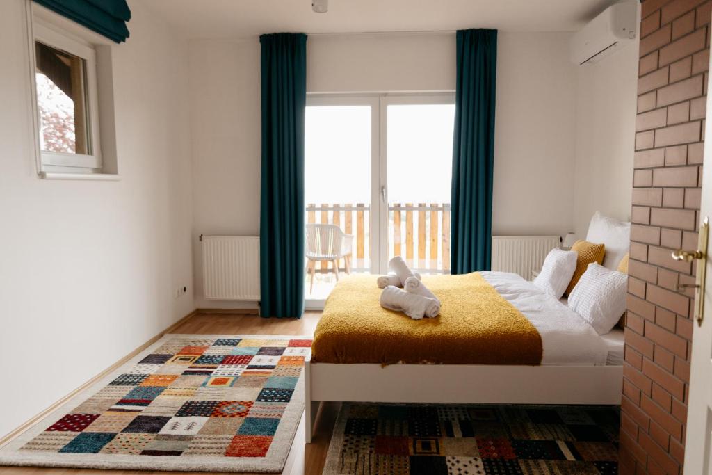 Postel nebo postele na pokoji v ubytování Csillagvirág Apartman