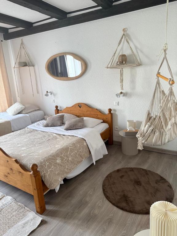Postel nebo postele na pokoji v ubytování Hotel Wistub Le PasSage