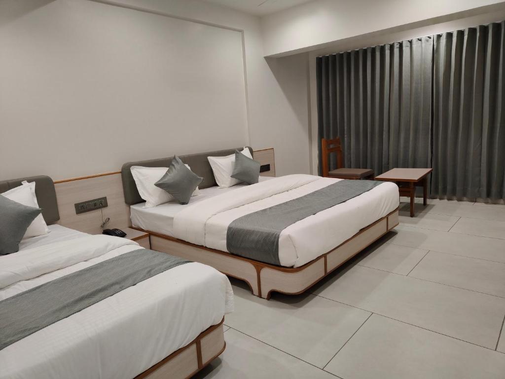 Postel nebo postele na pokoji v ubytování Hotel Kozar