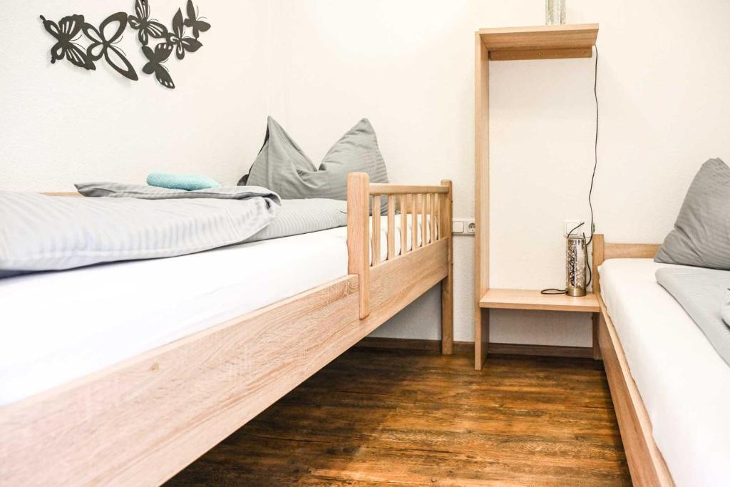 Posteľ alebo postele v izbe v ubytovaní Appartements Schwarzer Adler