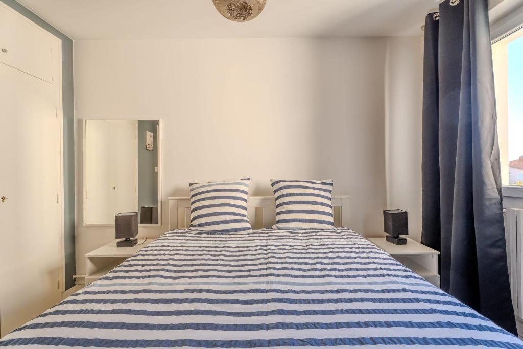 Posteľ alebo postele v izbe v ubytovaní Appartement Moderne & Confort Accès Plage et Commerces