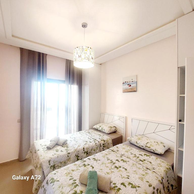 Postel nebo postele na pokoji v ubytování Safari Stay Appart front mer avec piscine