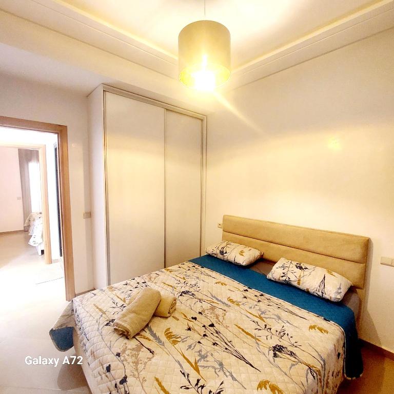 Postel nebo postele na pokoji v ubytování Safari Stay Appart front mer avec piscine