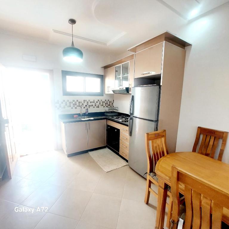 Kuchyň nebo kuchyňský kout v ubytování Safari Stay Appart front mer avec piscine