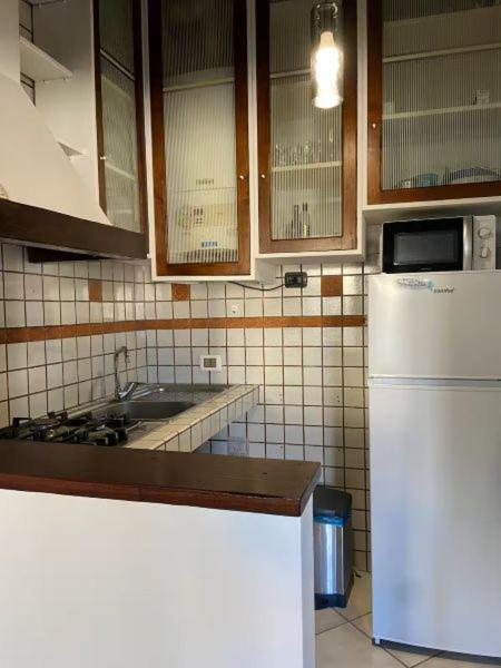 Kuchyň nebo kuchyňský kout v ubytování Appartamento Porticciolo