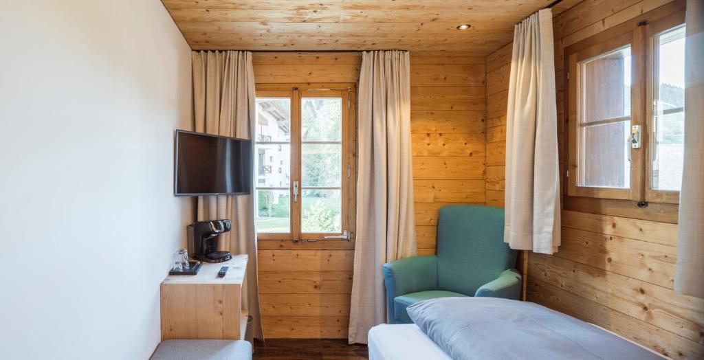 TV a/nebo společenská místnost v ubytování Hotel Mulin by Amanthos