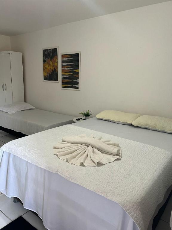 Cama ou camas em um quarto em Olinda Pousada