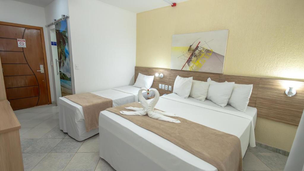 Postel nebo postele na pokoji v ubytování Hotel Beach Hills