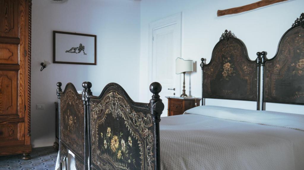 Postel nebo postele na pokoji v ubytování Boutique Hotel I Cinque Balconi