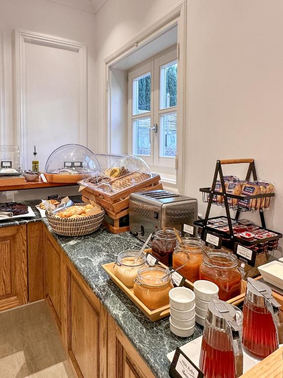 a kitchen with a counter with some food on it at Armata Boutique Hotel in Spetses